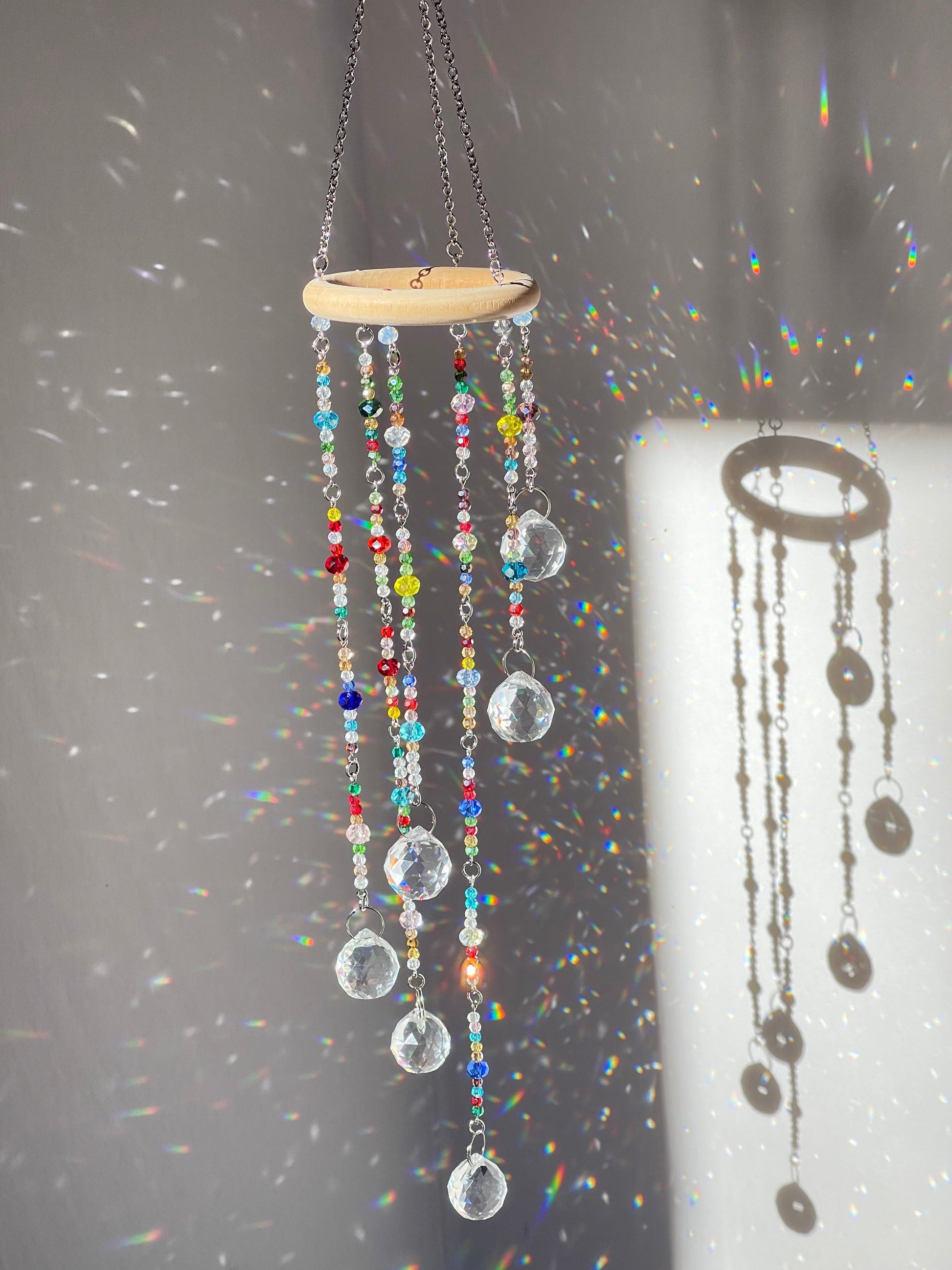 Artisan-made crystal window decoration with glass beads and clear prism drops