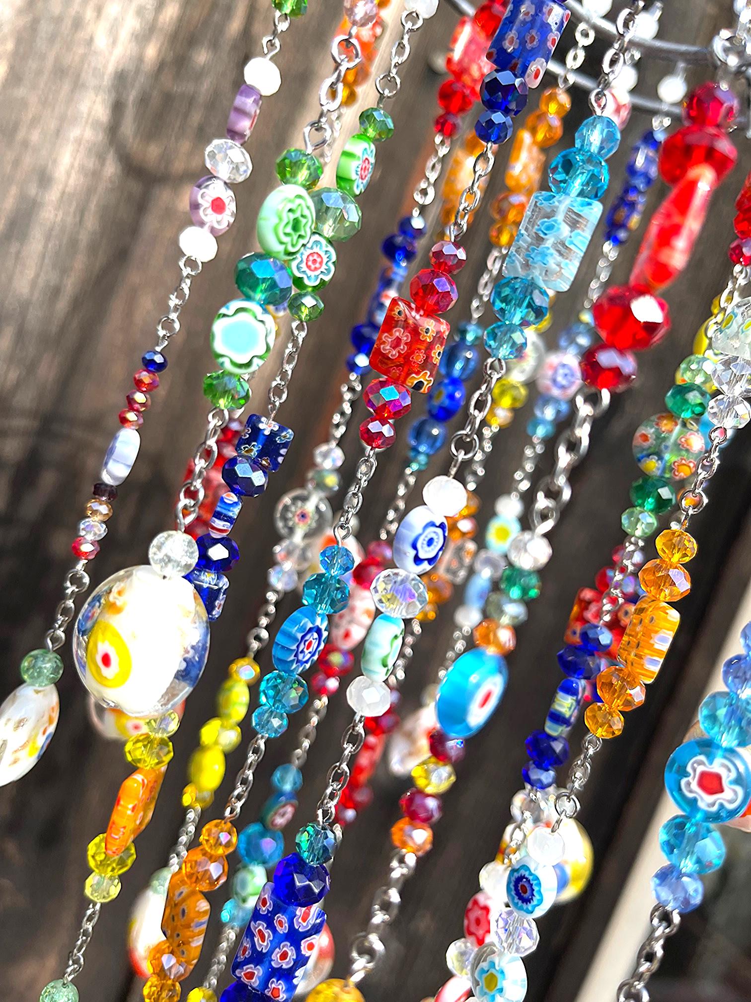 Handmade multicolor crystal sun catcher creating rainbows in window